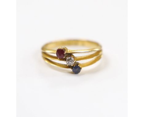 A late Victorian 18ct gold, sapphire ruby and diamond set three stone triple shank ring, size N, gross weight 2.9 grams.***CO