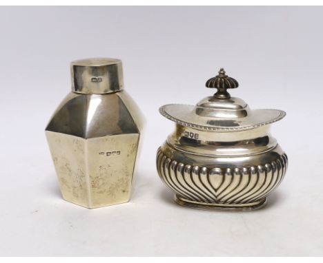 An Edwardian silver hexagonal tea caddy, by Nathan &amp; Hayes, Chester, 1908, 97mm and one other demi-fluted silver tea cadd