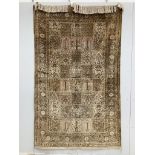 A Kashmir ‘silk’ rug, woven all over with rectangles filled with stylised flowers, 220 x 138cm***