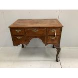 A Queen Anne Revival feather banded walnut kneehole dressing table (front leg a/f), width 88cm,