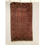 A Tekke Turkoman red ground rug, woven with rows of elephant’s foot motifs, 212 x 122cm***