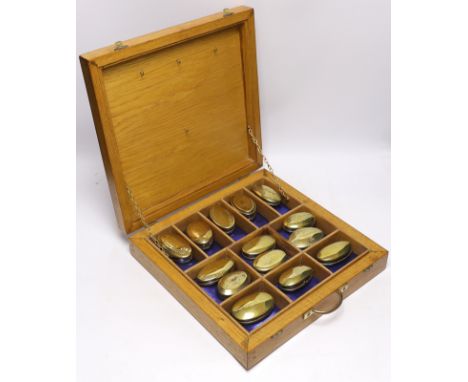 A collection of late 19th and early 20th century Welsh and English miner’s oval brass snuff boxes, most engraved with owner’s