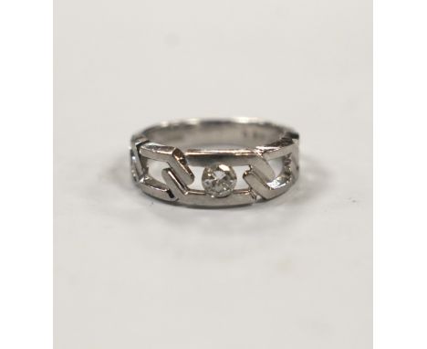 A modern pierced white metal (stamped PT900) and solitaire diamond set ring, size K, gross weight 6.7 grams.***CONDITION REPO