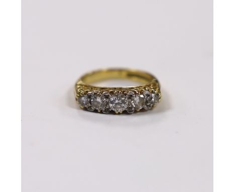 A modern 18ct gold and graduated five stone diamond set half hoop ring, size G, gross weight 5.2 grams.***CONDITION REPORT***