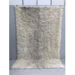 A faux sheepskin carpet, 290 x 200cm***CONDITION REPORT***PLEASE NOTE:- Prospective buyers are