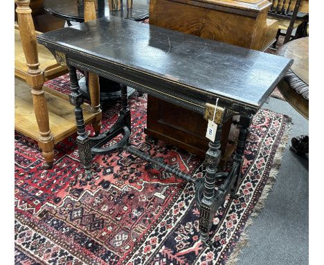 A late Victorian aesthetic movement ebonised folding card table, width 92cm, depth 44cm, height 76cm***CONDITION REPORT***PLE