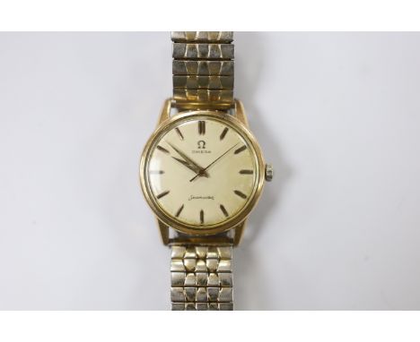 A gentleman's steel and  gold plated Omega Seamaster manual wind wrist watch, cased diameter 35mm, on a later associated flex