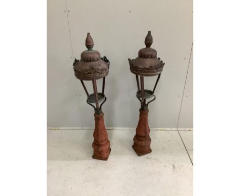 A pair of Victorian copper and cast iron lamps, height 122cm***CONDITION REPORT***PLEASE NOTE:- Prospective buyers are strong