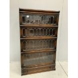 A Globe Wernicke oak four section bookcase with leaded glazed doors, width 86cm, depth 30cm,