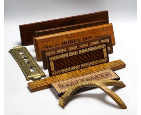 Nine cribbage boards including a horn example, 'Wills Tobacco' advertising and bone and marquetry examples, largest 42cm in l