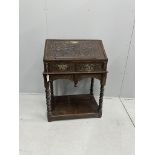 A carved oak bureau, width 68cm, depth 48cm, height 97cm***CONDITION REPORT***PLEASE NOTE:-