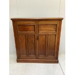 An Edwardian mahogany two door side cabinet, (loose plinth), width 124cm, depth 29cm, height