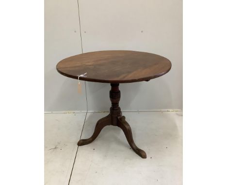An early 19th century circular mahogany tilt top tripod tea table, diameter 84cm, height 72cm***CONDITION REPORT***PLEASE NOT
