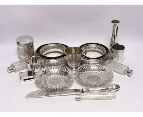 A group of silver and a white metal items including two Middle Eastern ring vases, two foliate dishes, a vase and a canister,