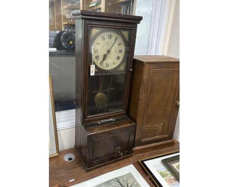 A Gledhill-Brook Time Recorder clocking-in machine, on associated cupboard, combined height 183cm***CONDITION REPORT***The cl