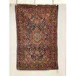 An Isphahan pink medallion rug, with a blue field, 200 x 130cm***CONDITION REPORT***PLEASE NOTE:-