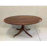 A George III and later satinwood banded oval mahogany tilt top dining table, width 152cm, depth