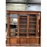 A pair of mid 20th century Sheraton style pitch pine and ply open bookcases, the adjustable