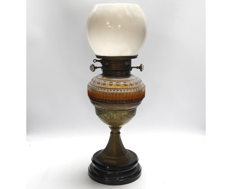 A Victorian glass and brass oil lamp by Jones & Willis, 53cm high***CONDITION REPORT***Glass font not cracked but interior th