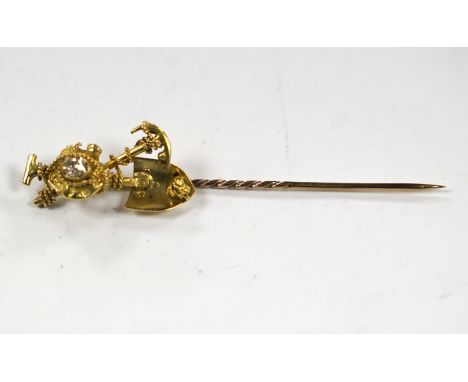 An early 20th century 9ct and diamond set 'Australian miner's' stick pin, 63mm, 4 grams.***CONDITION REPORT***PLEASE NOTE:- P