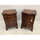 A pair of reproduction four drawer mahogany serpentine bedside chests, width 40cm, depth 35cm,