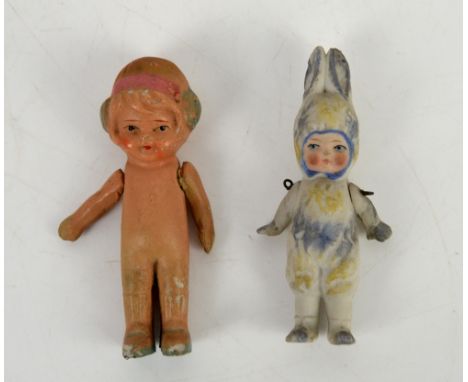 A German bisque miniature doll in rabbit costume, German, circa 1910, Miniature flapper girl ceramic doll, circa 1920, both a