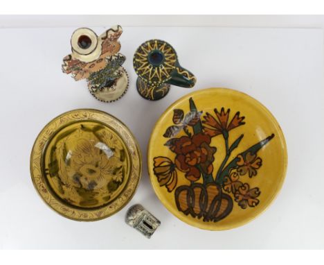 Mary Wondrausch slip decorated pottery; two bowls decorated with flowers, one monogrammed MW to base, 24.5cm diameter and the