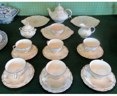 A Royal Doulton 'Monteigne' pattern tea service, comprising: 6 trios, 3 cake plates, teapot, cream jug, slop bowl and sugar b