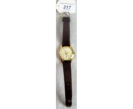 Garrard:  A gentleman's 9ct gold wristwatch, brushed circular dial, baton numerals, subsidiary seconds at six o'clock and com