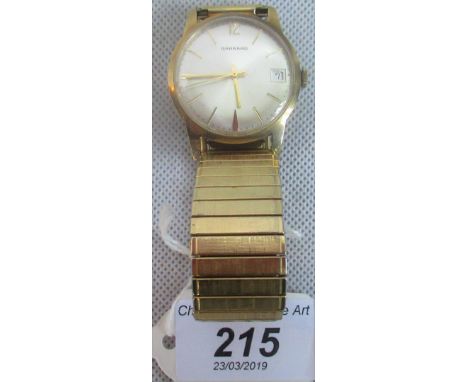 Garrard:  A gentleman's wristwatch, brushed circular dial, baton numerals, date adjust at 3 o'clock, sweep seconds and commem
