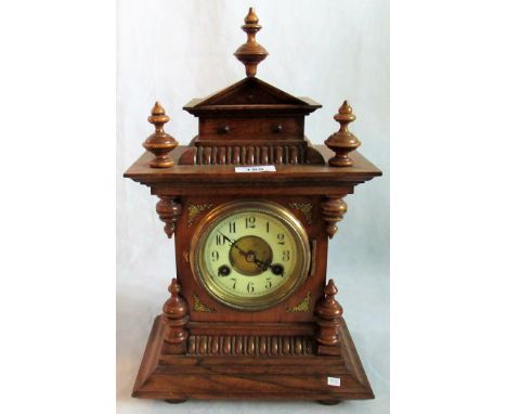 An Edwardian oak mantle clock.
