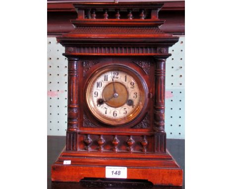 An Edwardian oak mantle clock.