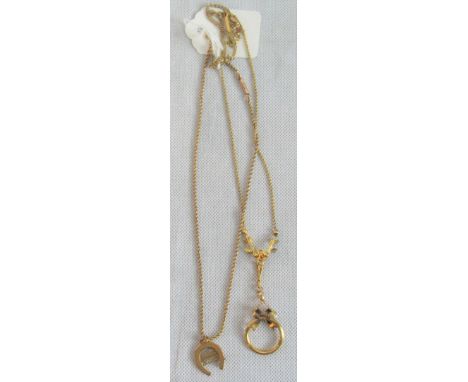 An Edwardian turquoise and baroque pearl circle pendant, to seed pearl set mount and rope twist chain, together with a horse-