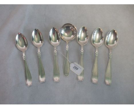 A set of six Scandinavia silver dessert spoons and a silver ladle.