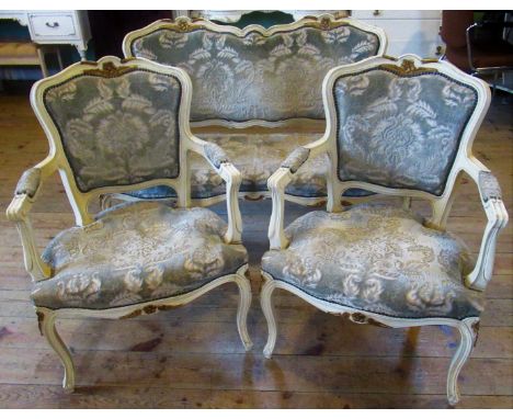 A contemporary white and gilt decorated three piece parlour suite, comprising two seater sofa and two chairs.