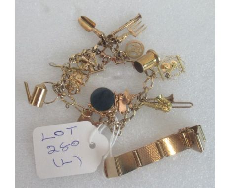A 9ct gold charm bracelet, suspending numerous charms, including a saxophone, clarinet and a trowel and fork, together with a