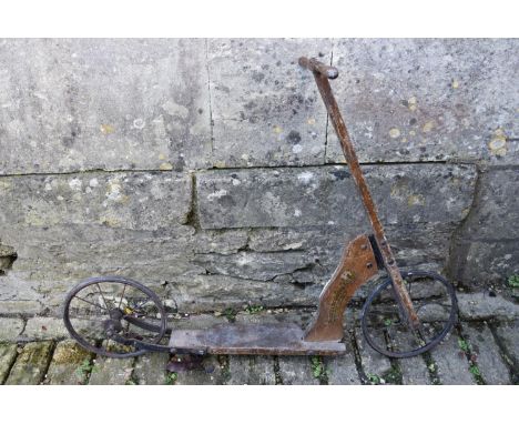 An early 20th century toy scooter (The Auto Scooter), H = 80cm W = 103cm 