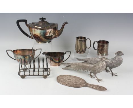 A group of plated items, including two christening mugs, a pair of models of a cock and hen pheasant, pair of entrées dishes,