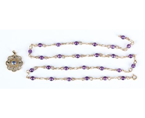 A German sapphire and marcasite pendant in a bead and wirework design, detailed '333', weight 1.4g, length 2.4cm, and a gold 