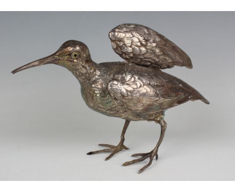 An early 20th century German silver model of a snipe, inset with glass eyes, the hinged wings and body with feather detail, i