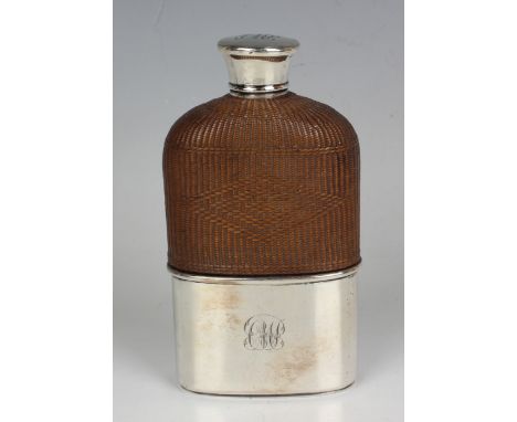 A Victorian silver mounted and woven wicker covered glass hip flask with screw lid and detachable cup, London 1855 by Thomas 