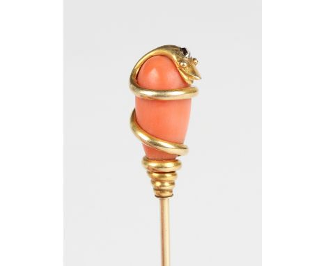 A gold, coral and diamond stickpin, circa 1870, the finial with a serpent coiling around a drop shaped coral, mounted with a 