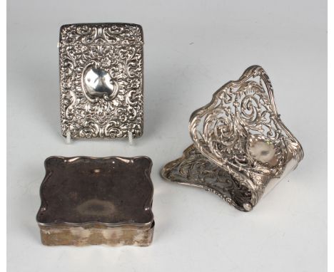 An Edwardian silver card case, embossed with flowers and scrolls, Chester 1902 by William Neale, weight 68.4g, height 10.4cm,