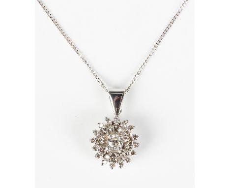 A diamond oval cluster pendant, claw set with the principal Old European cut diamond to the centre, otherwise set with circul