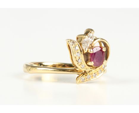 A gold, ruby and diamond ring, claw set with an oval cut ruby and two marquise shaped diamonds, otherwise set with circular c