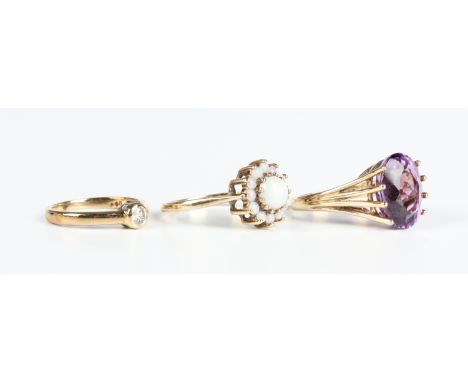 A gold and opal cluster ring, detailed '9ct', ring size approx O1/2, a 9ct gold ring, claw set with an oval cut amethyst, Lon