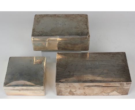 A George V silver rectangular cigarette case, the hinged lid with engine turned decoration, London 1928, length 16.5cm, toget