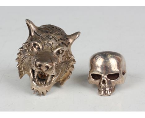 An Elizabeth II large silver ring in the form of a wolf's head, London 2003, and another silver ring in the form of a skull, 