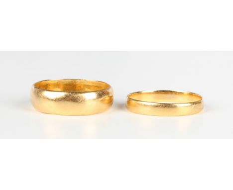 A late Victorian 22ct gold wedding ring, London 1889, ring size approx J, and another 22ct gold wedding ring, London 1960, ri