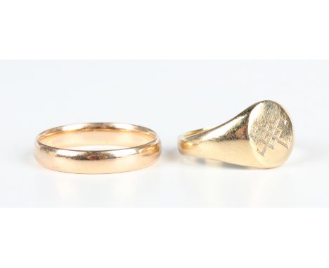 A 9ct gold wedding ring, Birmingham 1937, ring size approx P1/2, and a 9ct gold oval signet ring, Birmingham 2002, ring size 